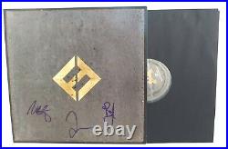 The Foo Fighters Signed Concrete and Gold Vinyl Record Album Beckett Autographed